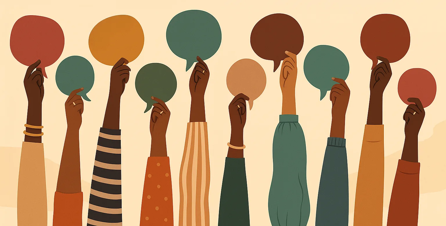 An illustration of many raised hands with different skin tones, each holding up a colourful speech bubble.